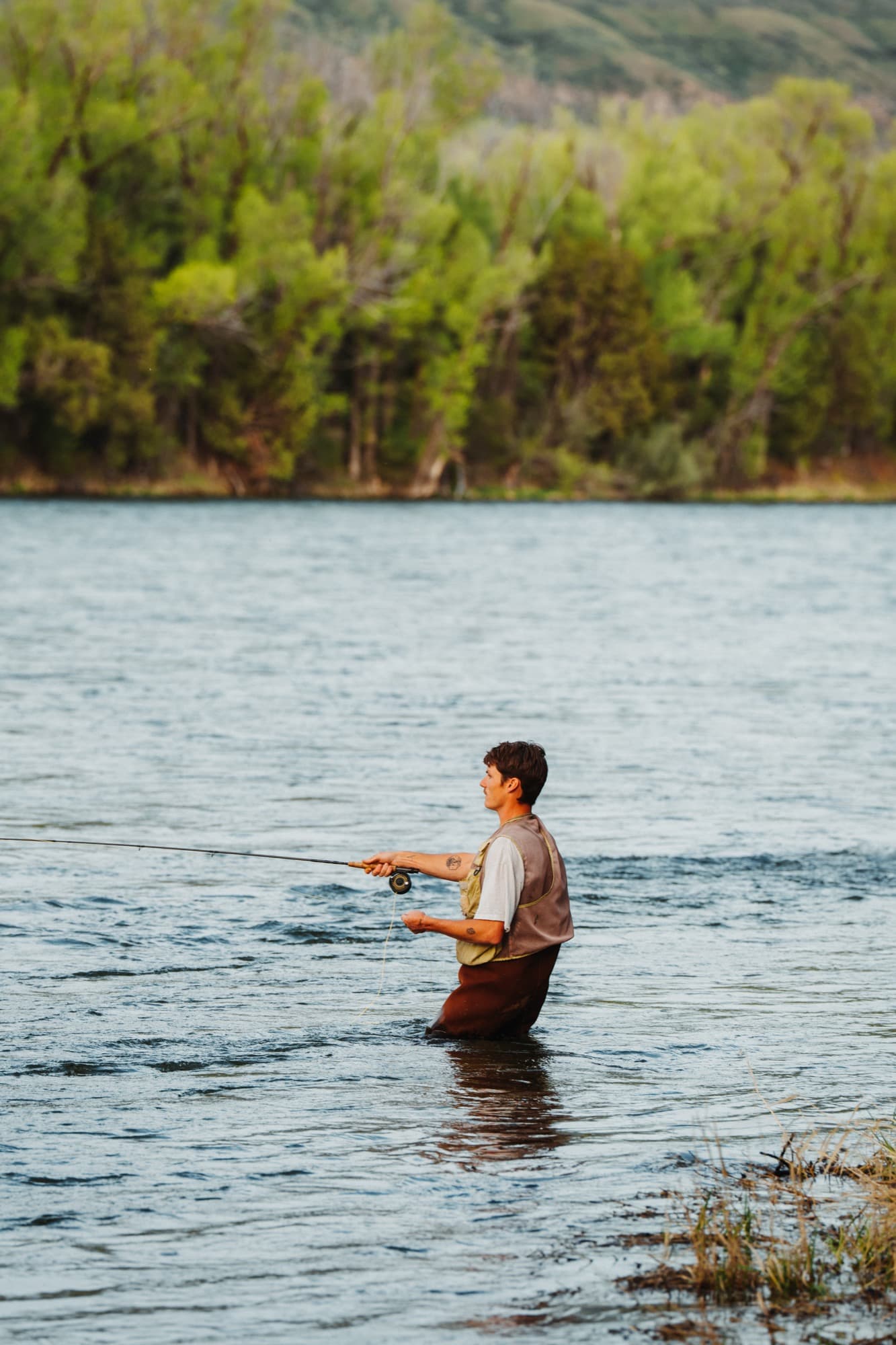 Fly fishing waist-deep in the South Fork of the Snake River